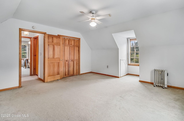 18 Johnson Ln, Poestenkill, NY 12018 - bonus room featuring radiator, vaulted ceiling, ceiling fan, and light carpet