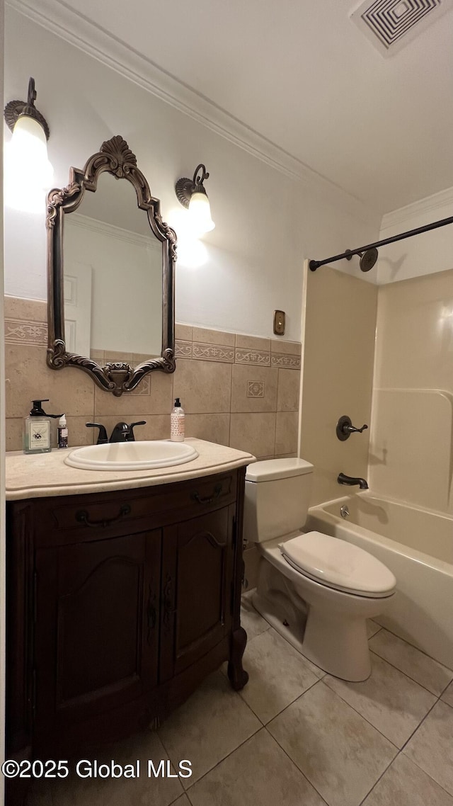 bathroom featuring visible vents, toilet, ornamental molding, tile patterned floors, and vanity