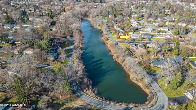 birds eye view of property with a water view