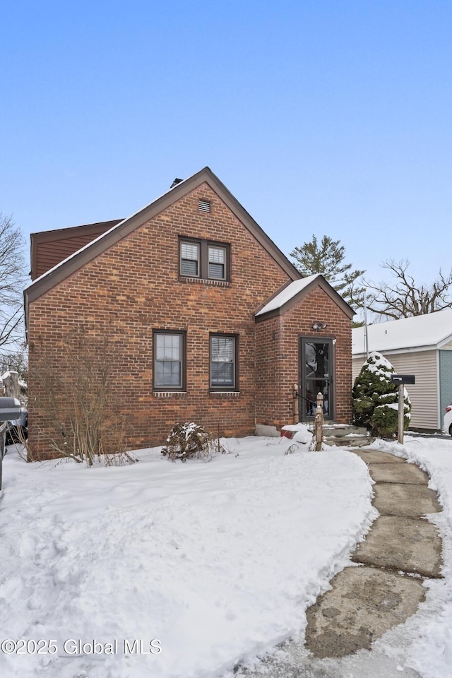 view of front of home with brick siding