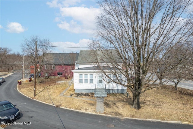 view of front of property with a shingled roof