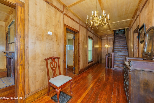 interior space with wooden ceiling, an inviting chandelier, stairs, and hardwood / wood-style floors