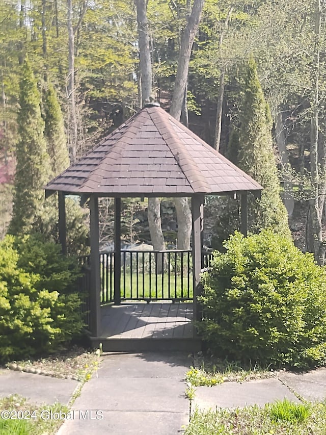 surrounding community with a wooded view and a gazebo