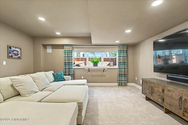 living area with recessed lighting, baseboards, and light colored carpet