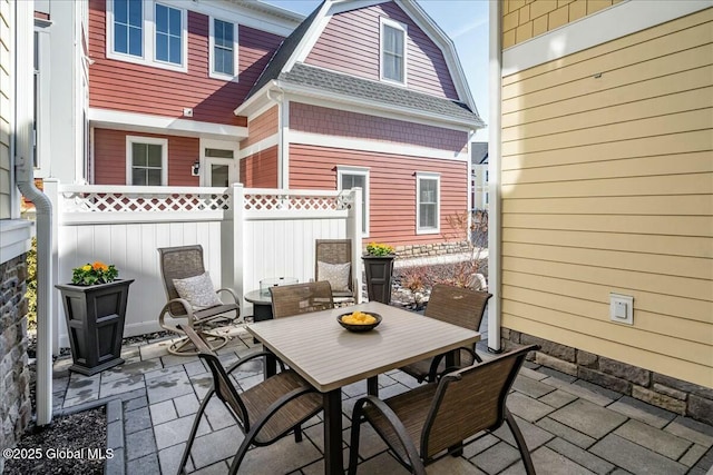 view of patio / terrace with outdoor dining area and fence