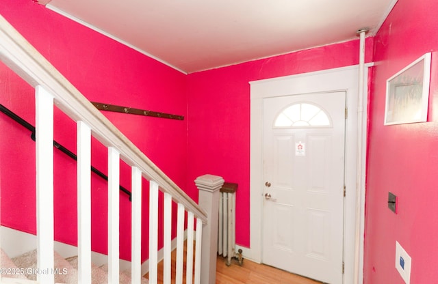 entryway with stairway and light wood finished floors