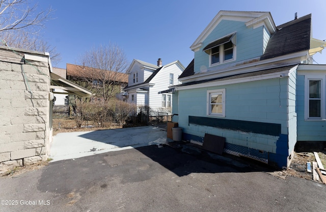 view of side of property featuring driveway