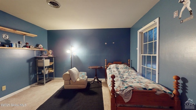 bedroom with baseboards, visible vents, and carpet flooring