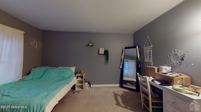 carpeted bedroom with baseboards