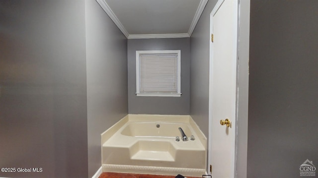 bathroom with crown molding and a bath