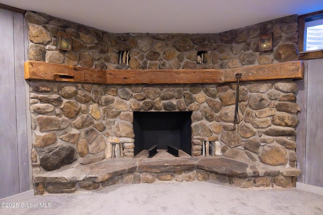 details featuring carpet and a stone fireplace