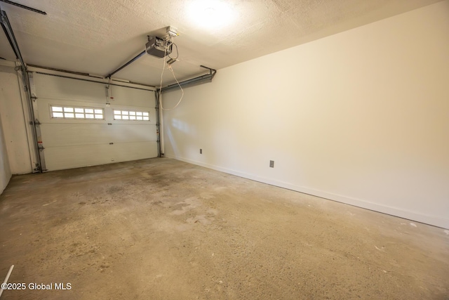 garage with baseboards and a garage door opener