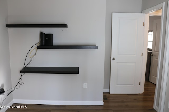 details featuring baseboards and wood finished floors