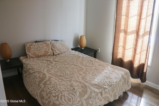 bedroom with wood finished floors