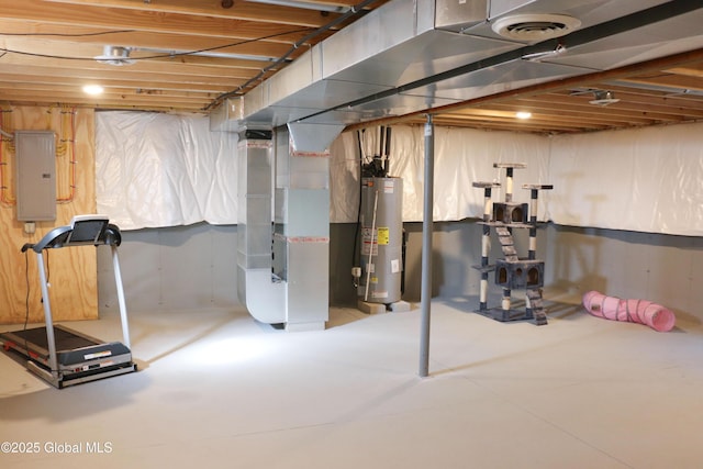 unfinished below grade area featuring water heater, heating unit, electric panel, and visible vents