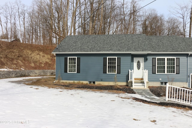 view of front of home with a shingled roof