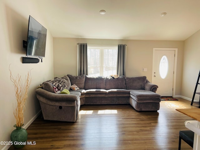 living room with dark wood finished floors and baseboards