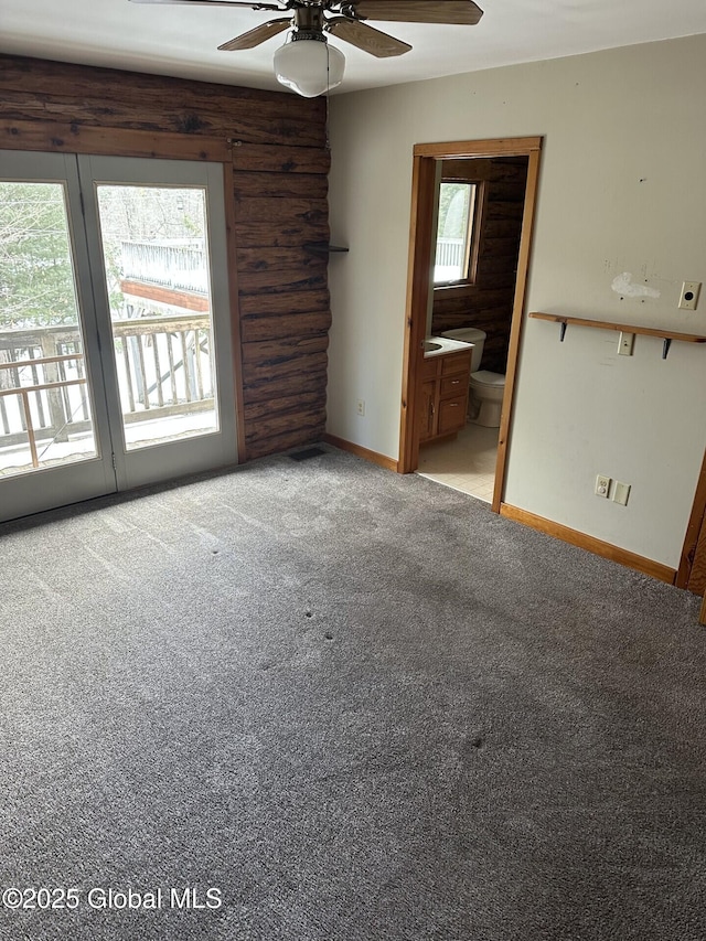 spare room with light carpet, baseboards, and a ceiling fan