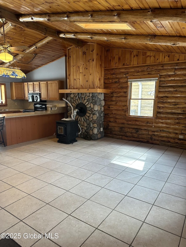 unfurnished living room featuring wood ceiling, light tile patterned floors, a wood stove, and vaulted ceiling with beams