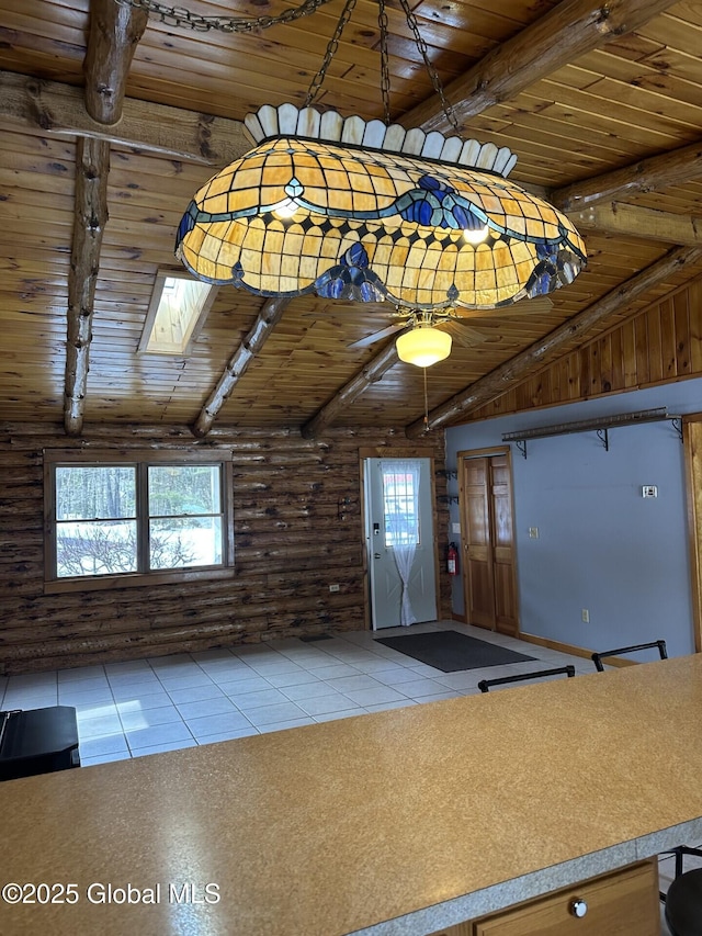 interior space featuring high vaulted ceiling, beamed ceiling, wooden ceiling, and log walls