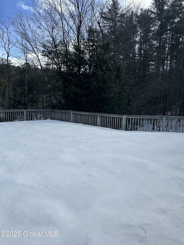 view of yard with a forest view