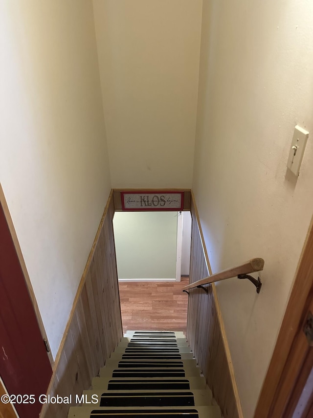 stairs with wood finished floors