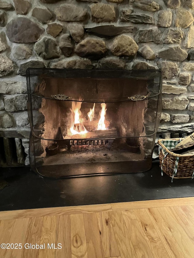 interior details with a lit fireplace