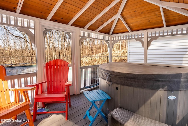 deck with a gazebo and a hot tub