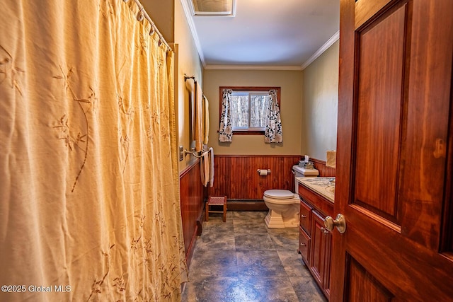 full bath with ornamental molding, wood walls, wainscoting, a baseboard heating unit, and toilet