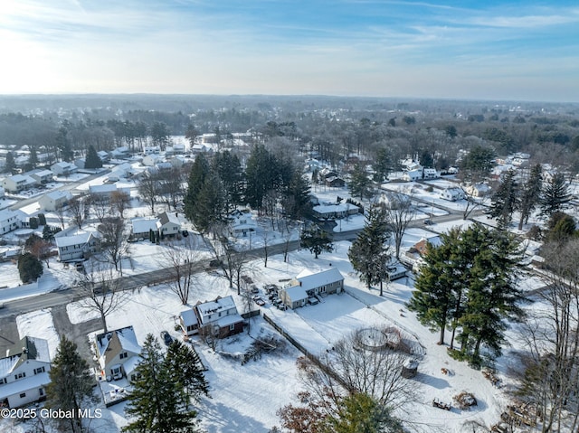 snowy aerial view featuring a residential view