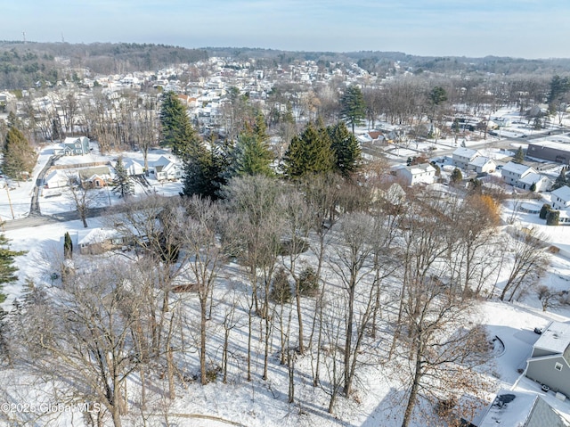 snowy aerial view featuring a residential view