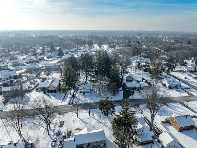 snowy aerial view featuring a residential view