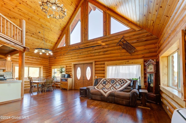 living room with hardwood / wood-style floors, an inviting chandelier, wood ceiling, and a wealth of natural light