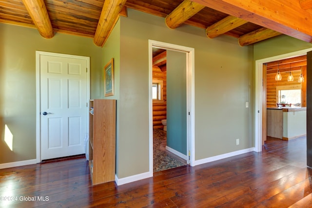 interior space featuring log walls, baseboards, wood ceiling, and hardwood / wood-style floors