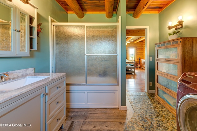 bathroom featuring beamed ceiling, hardwood / wood-style flooring, washer / dryer, log walls, and wood ceiling