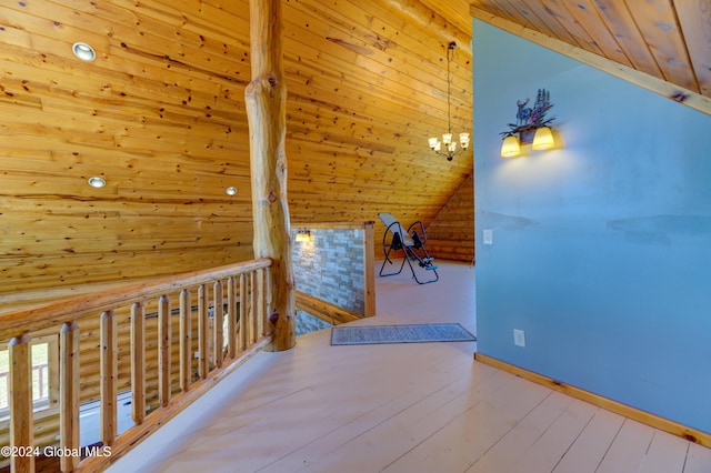 hall with log walls, lofted ceiling, wood ceiling, wood-type flooring, and a chandelier