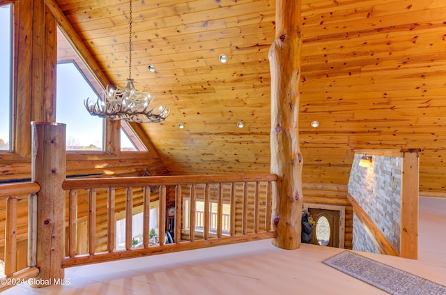 interior space with wood ceiling, a chandelier, and high vaulted ceiling