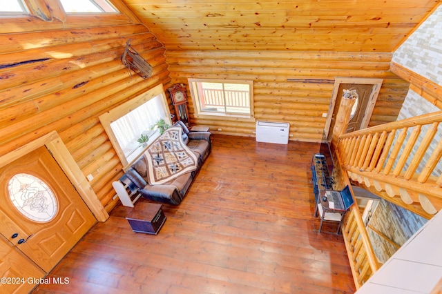 unfurnished living room with hardwood / wood-style flooring and lofted ceiling