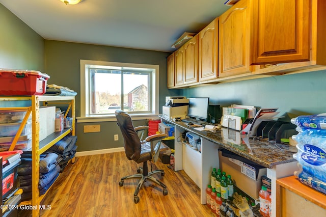 office area with wood finished floors and baseboards