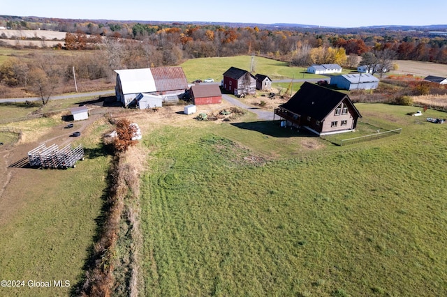 birds eye view of property featuring a rural view