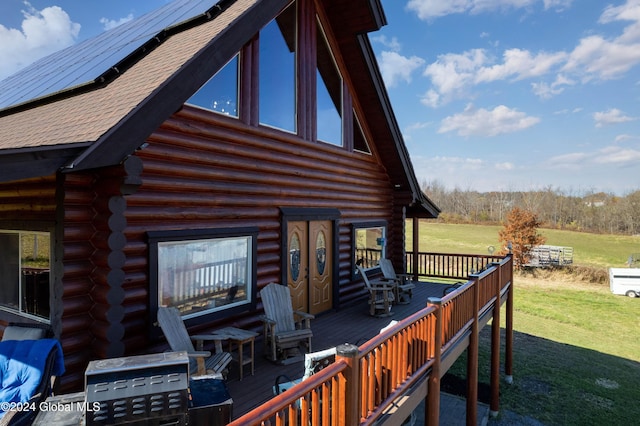 wooden terrace with a yard