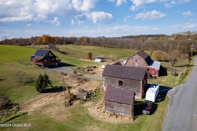 birds eye view of property with a rural view