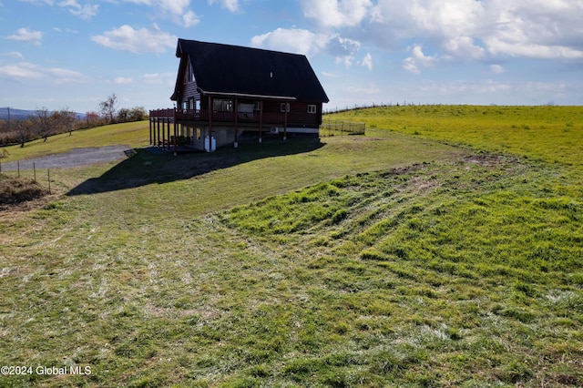 exterior space with a rural view and a wooden deck