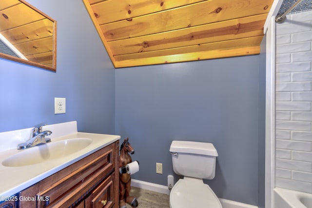 full bathroom featuring toilet, vanity, baseboards, and wood finished floors