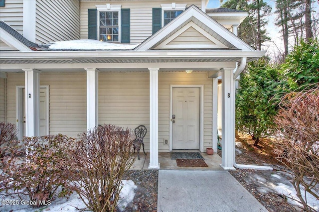 entrance to property with a porch