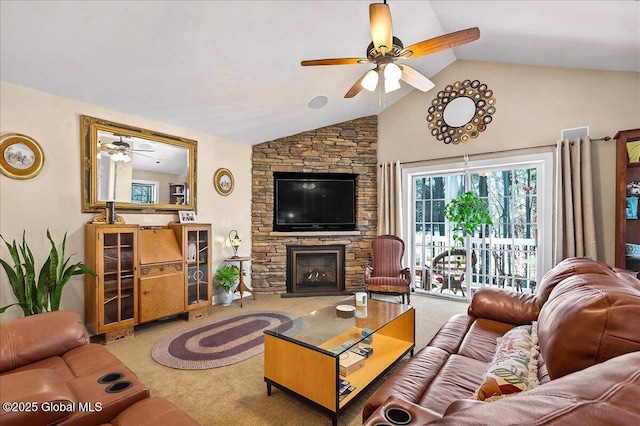 carpeted living room featuring ceiling fan, a fireplace, and lofted ceiling