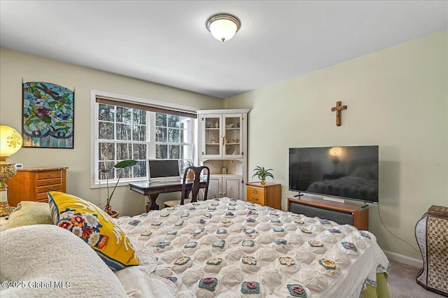 carpeted bedroom with baseboards