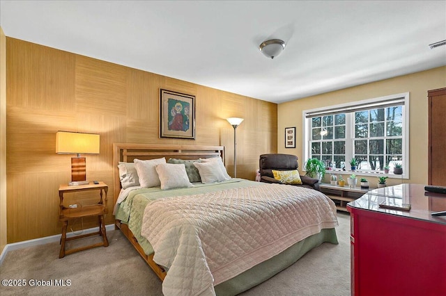 carpeted bedroom featuring visible vents and baseboards