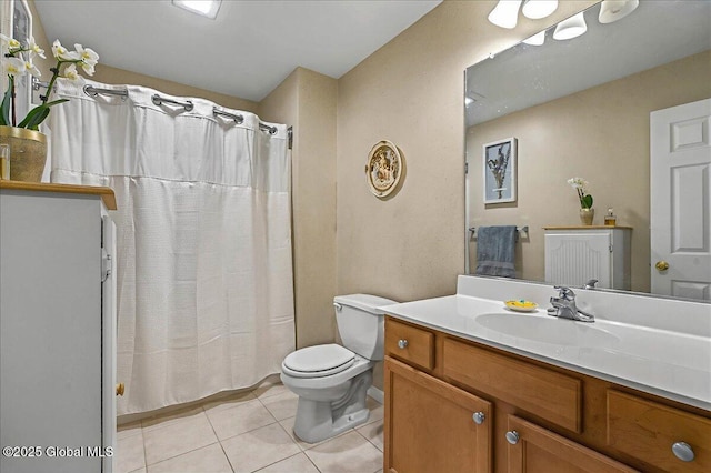 full bathroom with tile patterned flooring, curtained shower, toilet, and vanity