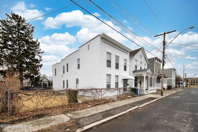 view of property exterior featuring a fenced front yard